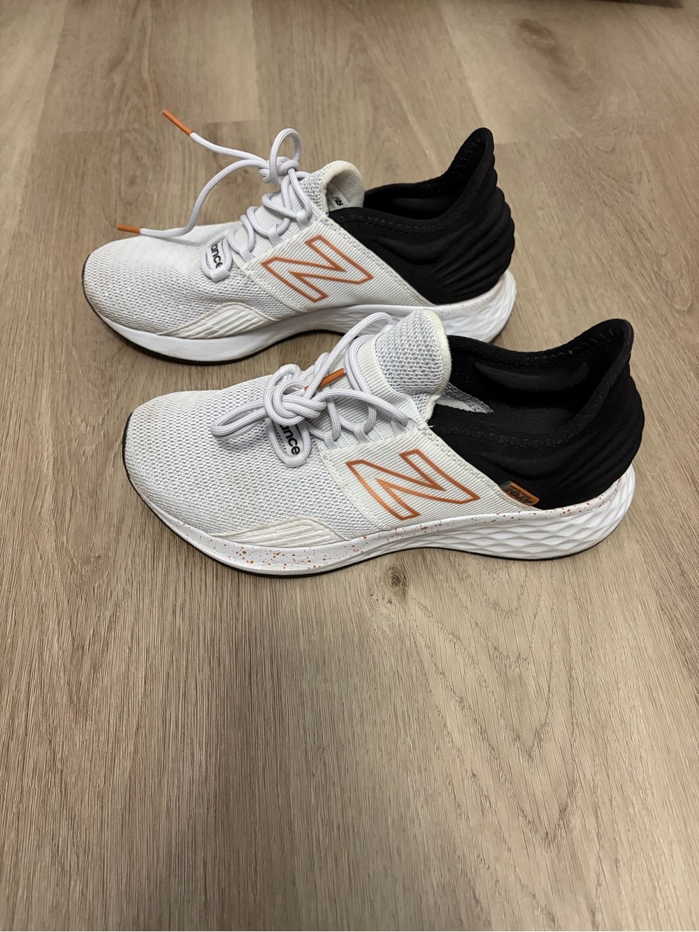 New Balance White and Black Athletic Shoes with gold Detailing